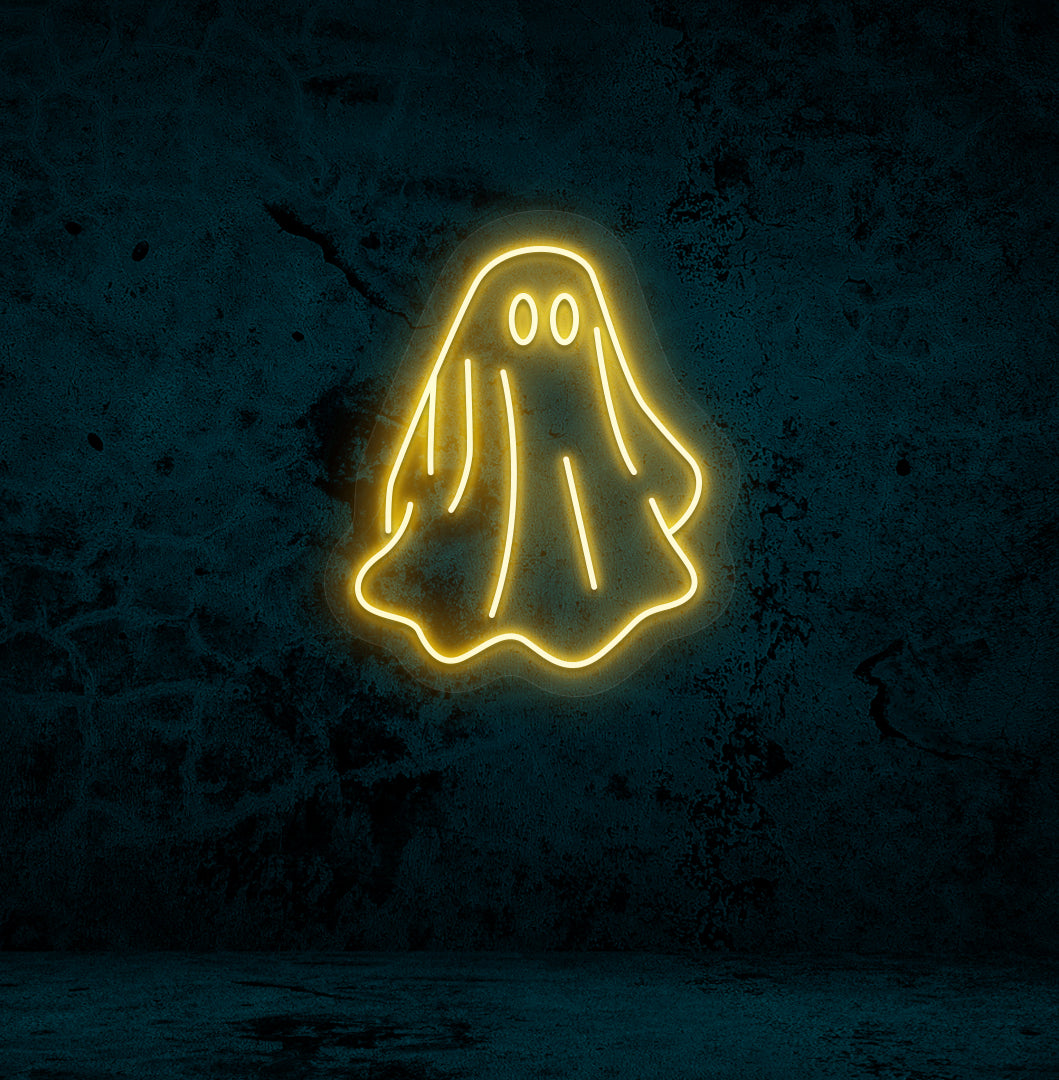 Stylish orange LED ghost neon sign mounted on wall.