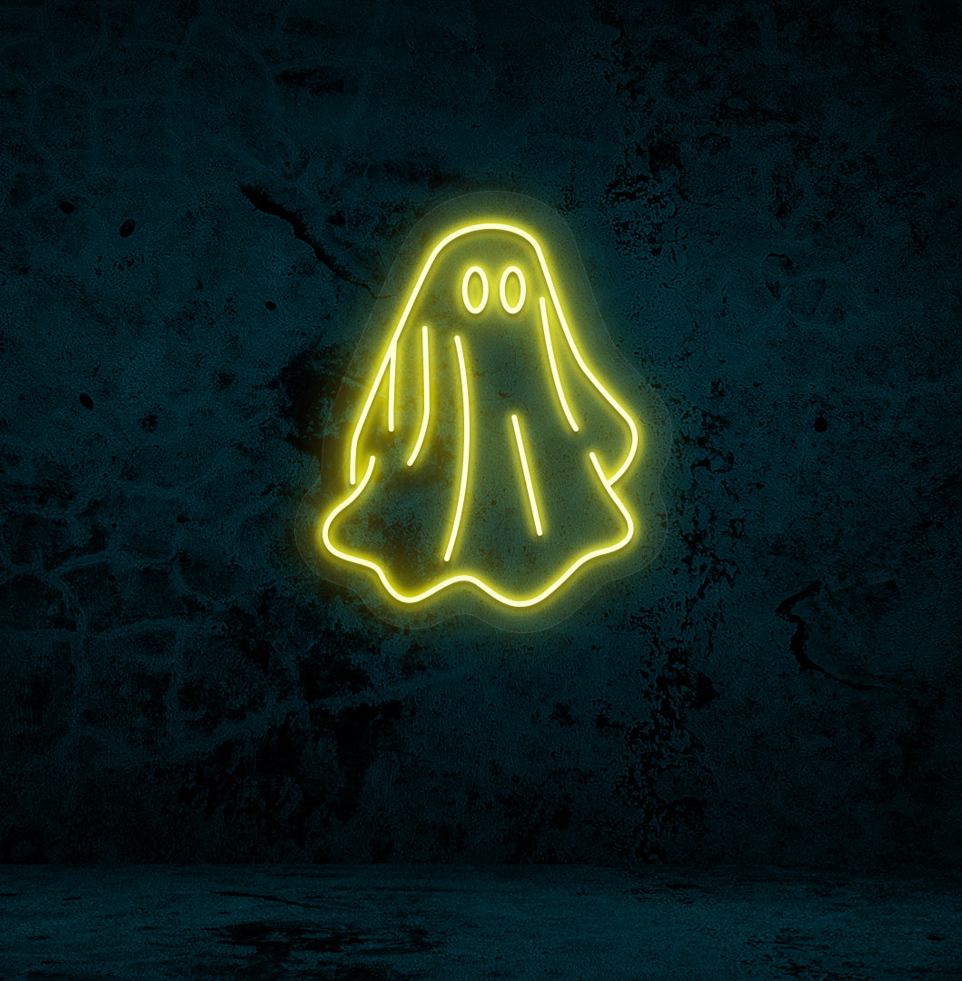 Stylish yellow LED ghost neon sign mounted on wall.
