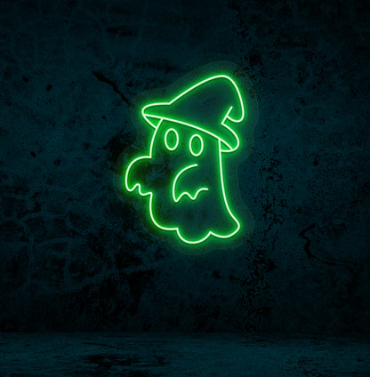 Halloween wall with "ghost with hat" neon sign glowing green.