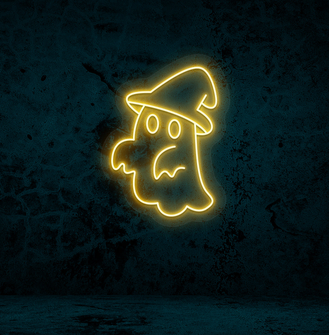 Halloween wall with "ghost with hat" neon sign glowing orange.