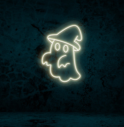 Halloween wall with "ghost with hat" neon sign glowing warm white.
