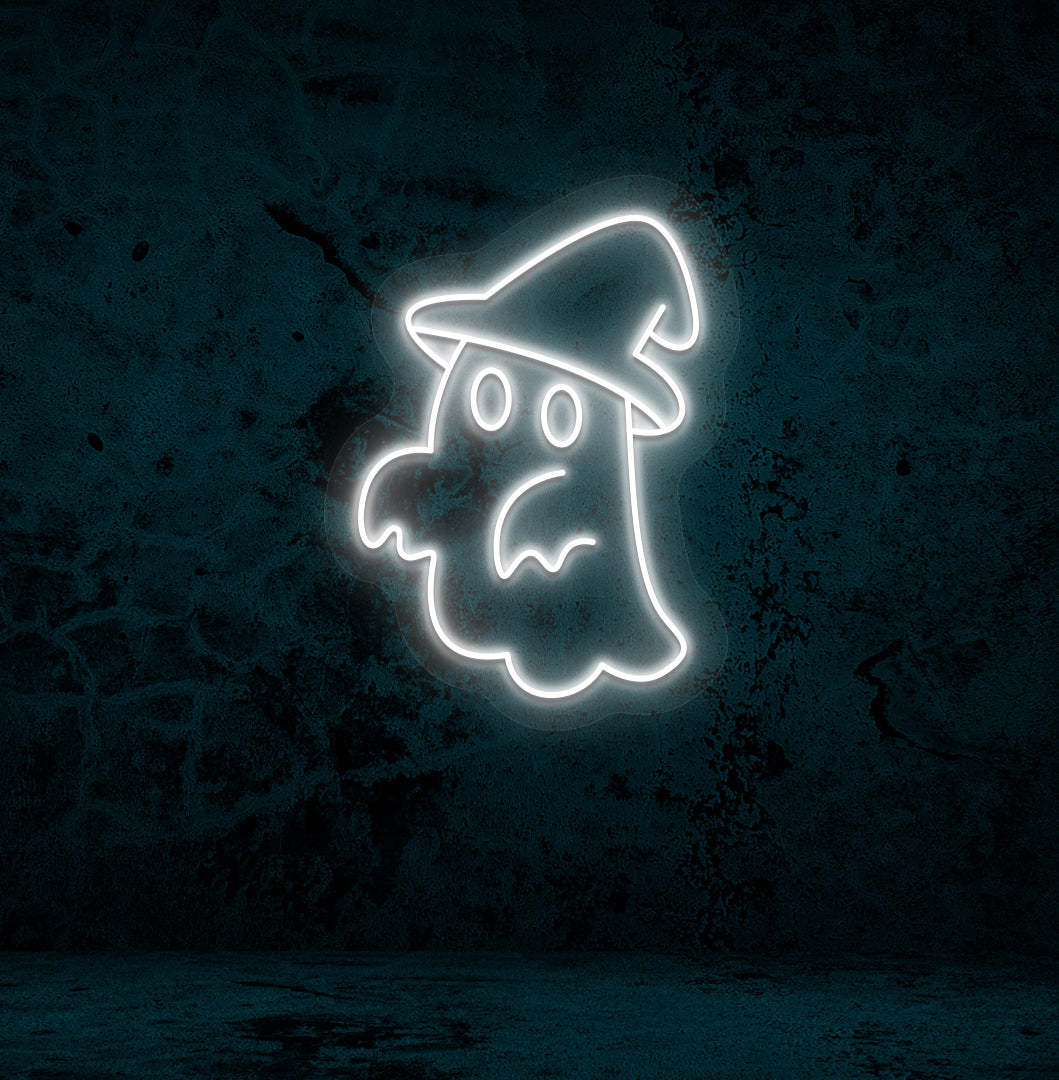 Image of a ghost with hat neon sign glowing on a wall in white color.