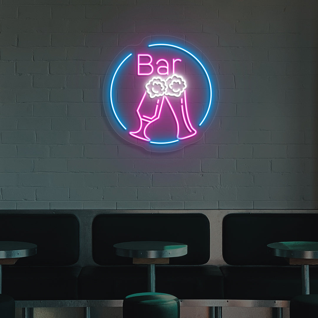 Image of a beer LED neon sign in circle glowing on wall in pink color.
