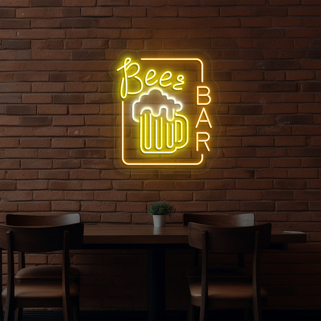 Image of a beer pub glass neon sign glowing on wall in orange color.