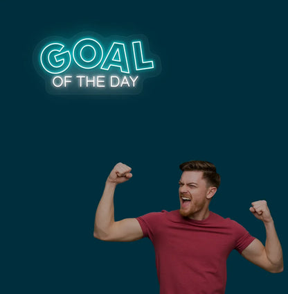 Image of a modern sports wall decor with goal of the day neon sign glowing ice blue.