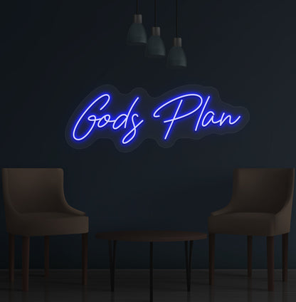 Image of an inspirational Gods Plan LED neon sign glowing on wall in blue color.