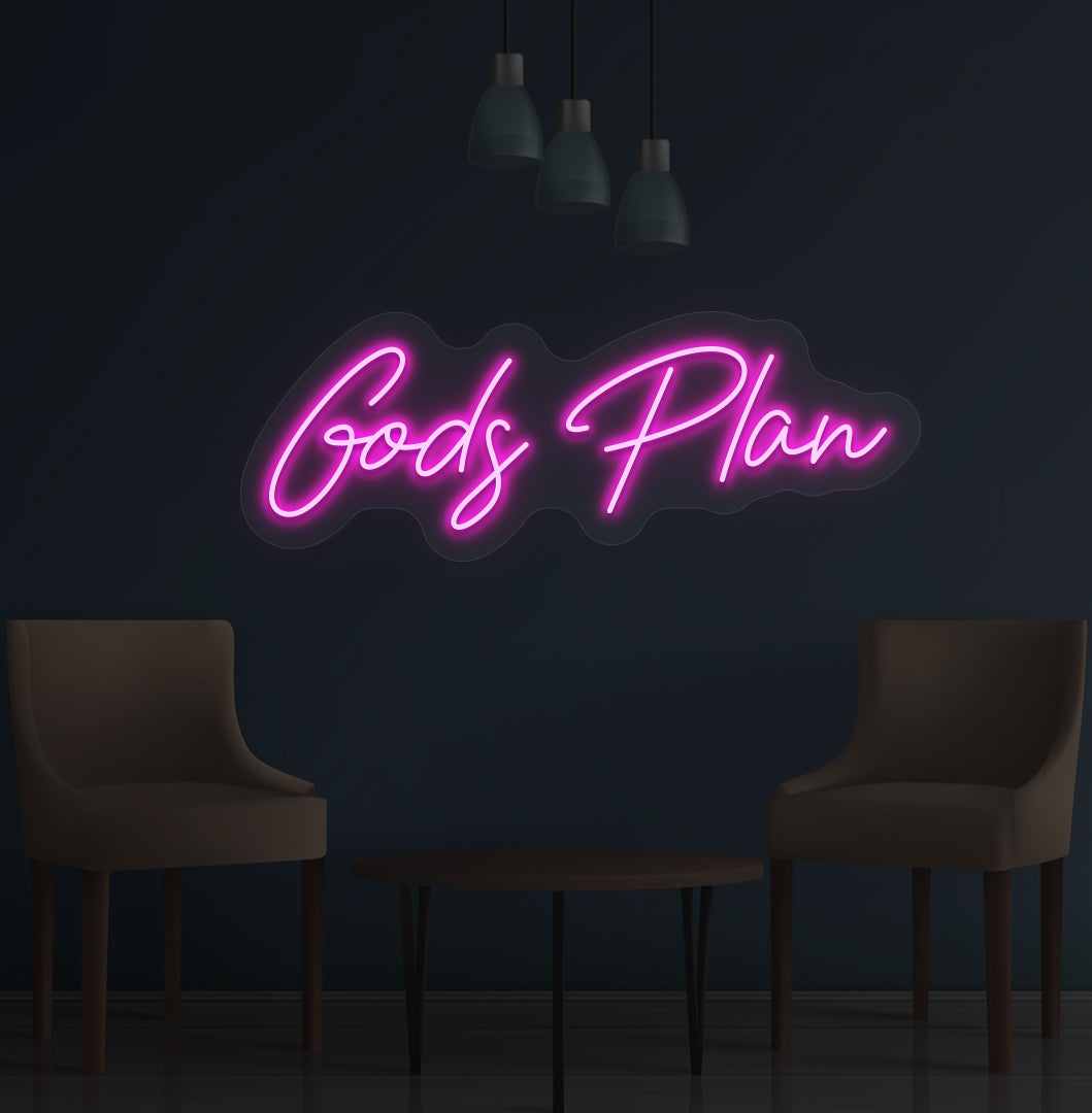 Image of an inspirational "God's Plan" LED neon sign glowing on a wall in pink color.