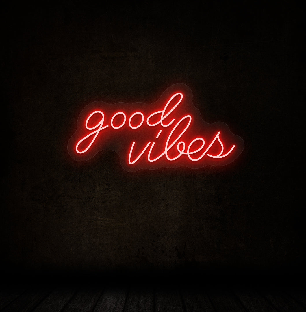 A stylish red LED "good vibes" neon sign mounted on a dark wall. Perfect for bedrooms, gaming, streaming setups, and cafés.