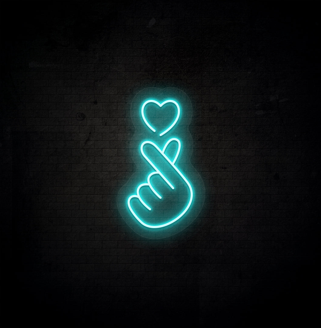 Image of a hand heart LED neon sign mounted on dark wall in ice blue color.