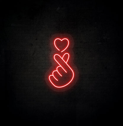 Image of a hand heart LED neon sign mounted on dark wall in red color.
