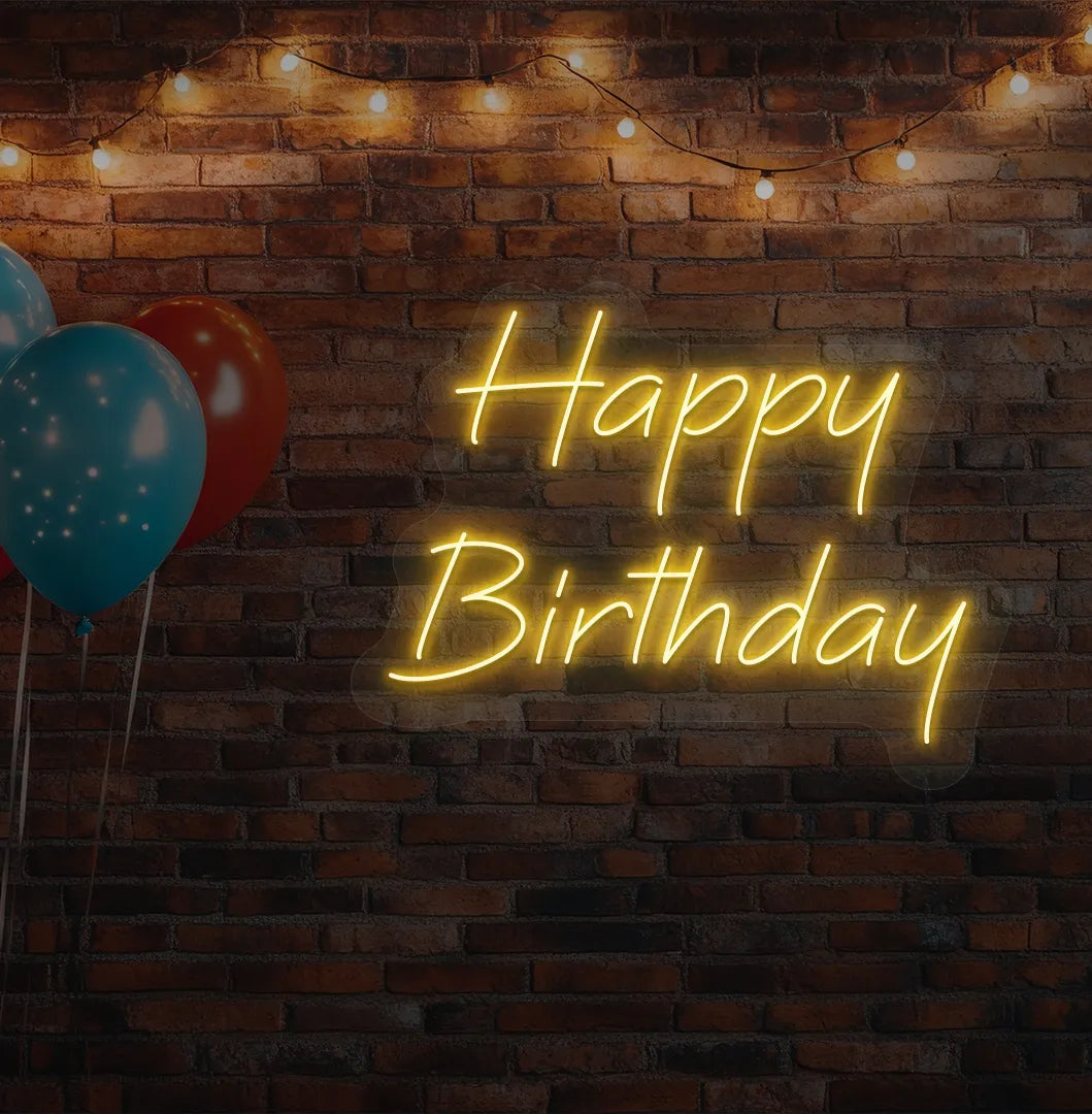 Image of a "Happy Birthday" LED neon sign glowing orange for birthday celebration backdrop.