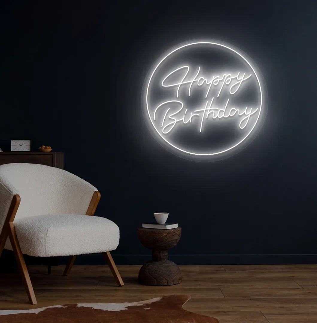 Happy Birthday in circle LED neon sign glowing white for celebration backdrop.