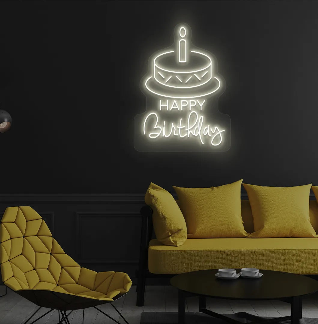 Trendy Happy Birthday cake neon sign mounted on decorative party wall in warm white color.
