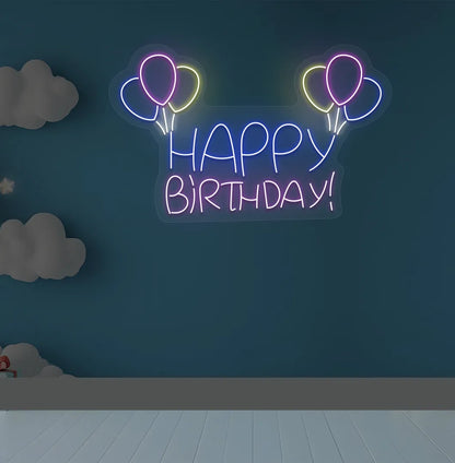 Trendy Happy Birthday balloon neon sign mounted on decorative party wall in purple color.