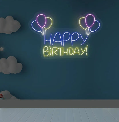 Trendy Happy Birthday balloon neon sign mounted on decorative party wall in yellow color.