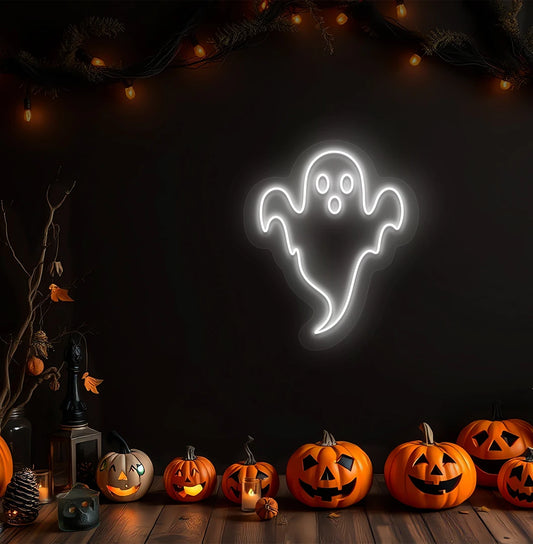 Image of a haunted ghost neon sign above pumpkins on Halloween wall in white color.