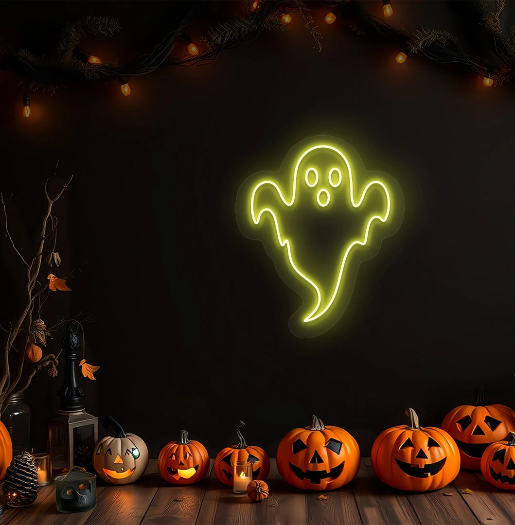 Modern Halloween wall with haunted ghost neon sign glowing yellow above pumpkins.