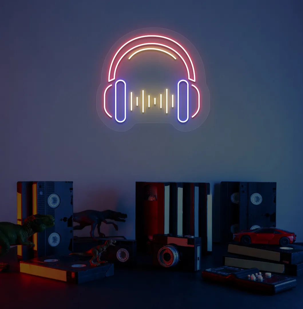 Image of a headphone neon sign in red color mounted on room wall.