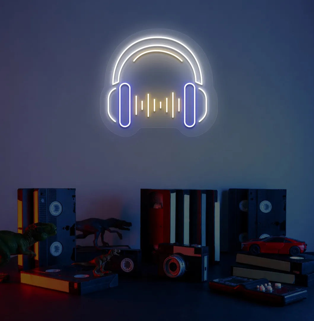 Image of a headphone neon sign in white color mounted on room wall.