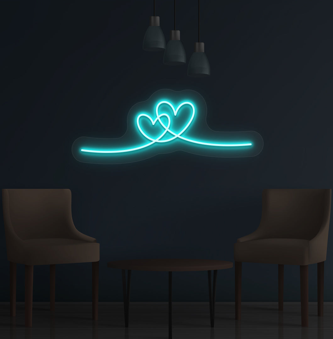 Image of a romantic heart LED neon sign glowing on a wall in ice blue color.
