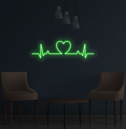 Stylish green LED heartbeat neon sign glowing on wall.