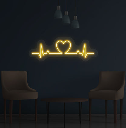 Stylish orange LED heartbeat neon sign glowing on wall.