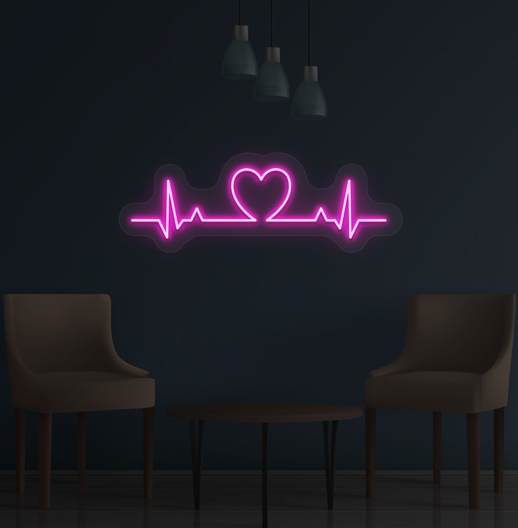 Image of a heartbeat LED neon sign glowing on a wall in pink color.
