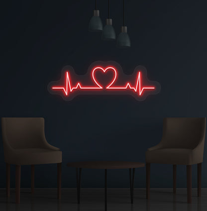 Image of a heartbeat LED neon sign glowing on a wall in red color.