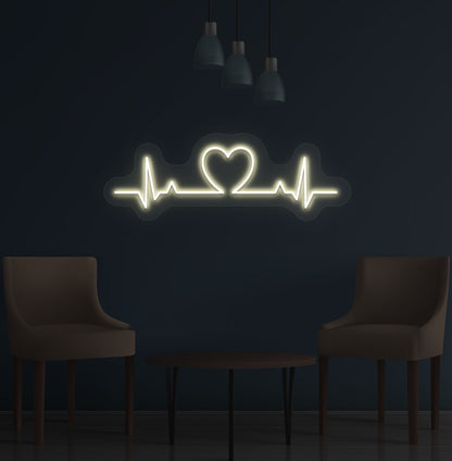 Stylish warm white LED heartbeat neon sign glowing on wall.