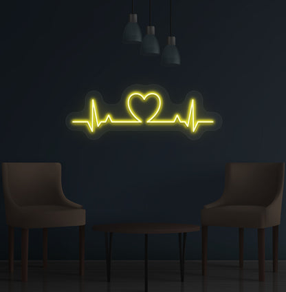 Stylish yellow LED heartbeat neon sign glowing on wall.