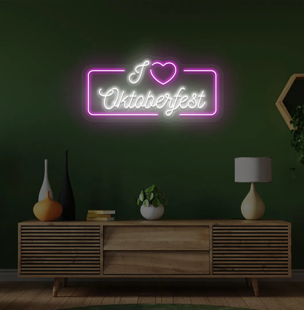 I Love Oktoberfest LED neon sign with pink glow mounted on wall.