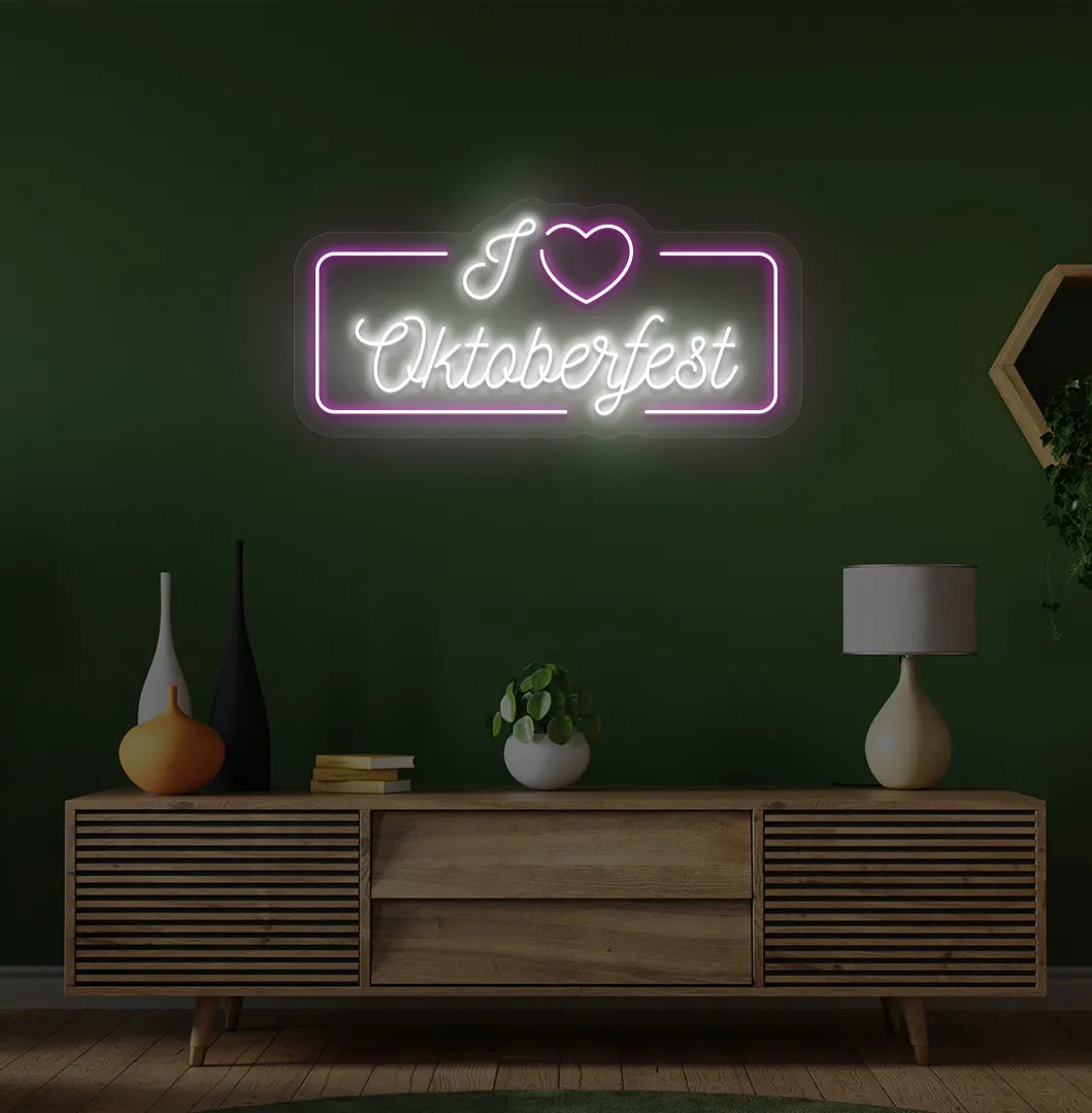 I Love Oktoberfest Neon Sign illuminated in purple and mounted on a wall