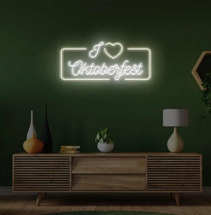 I Love Oktoberfest Neon Sign illuminated in warm white and mounted on a wall
