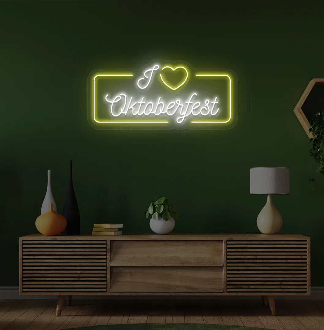 I Love Oktoberfest Neon Sign illuminated in yellow and mounted on a wall