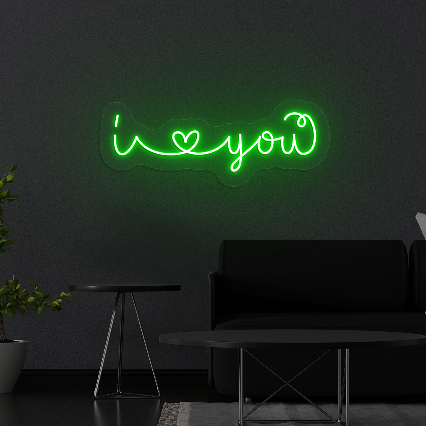 Stylish "I love you" LED neon mounted on wall in green.