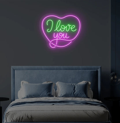 Romantic I love you heart neon sign in green mounted on bedroom wall.