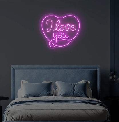 Modern bedroom wall with I love you neon sign in heart shape glowing pink.