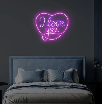 Romantic I love you heart neon sign in purple mounted on bedroom wall.