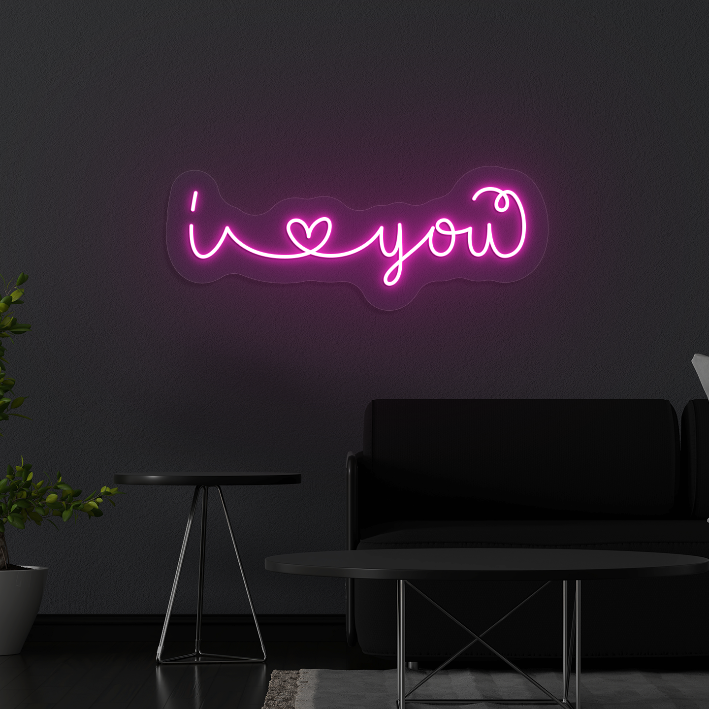 Image of a Romantic "I love you" neon sign glowing on a wall in pink color.