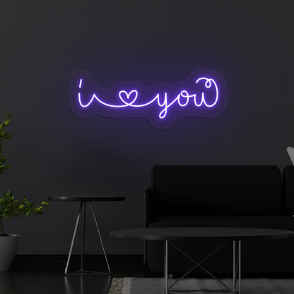 Stylish "I love you" LED neon mounted on wall in purple.
