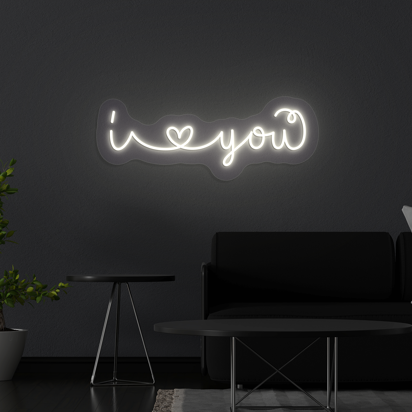 Stylish "I love you" LED neon mounted on wall in warm white.