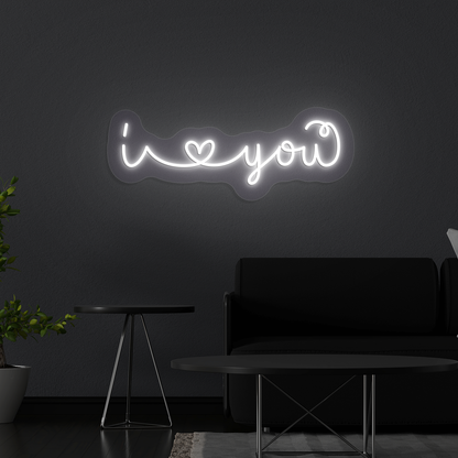 Image of a Romantic "I love you" neon sign glowing on a wall in white color.
