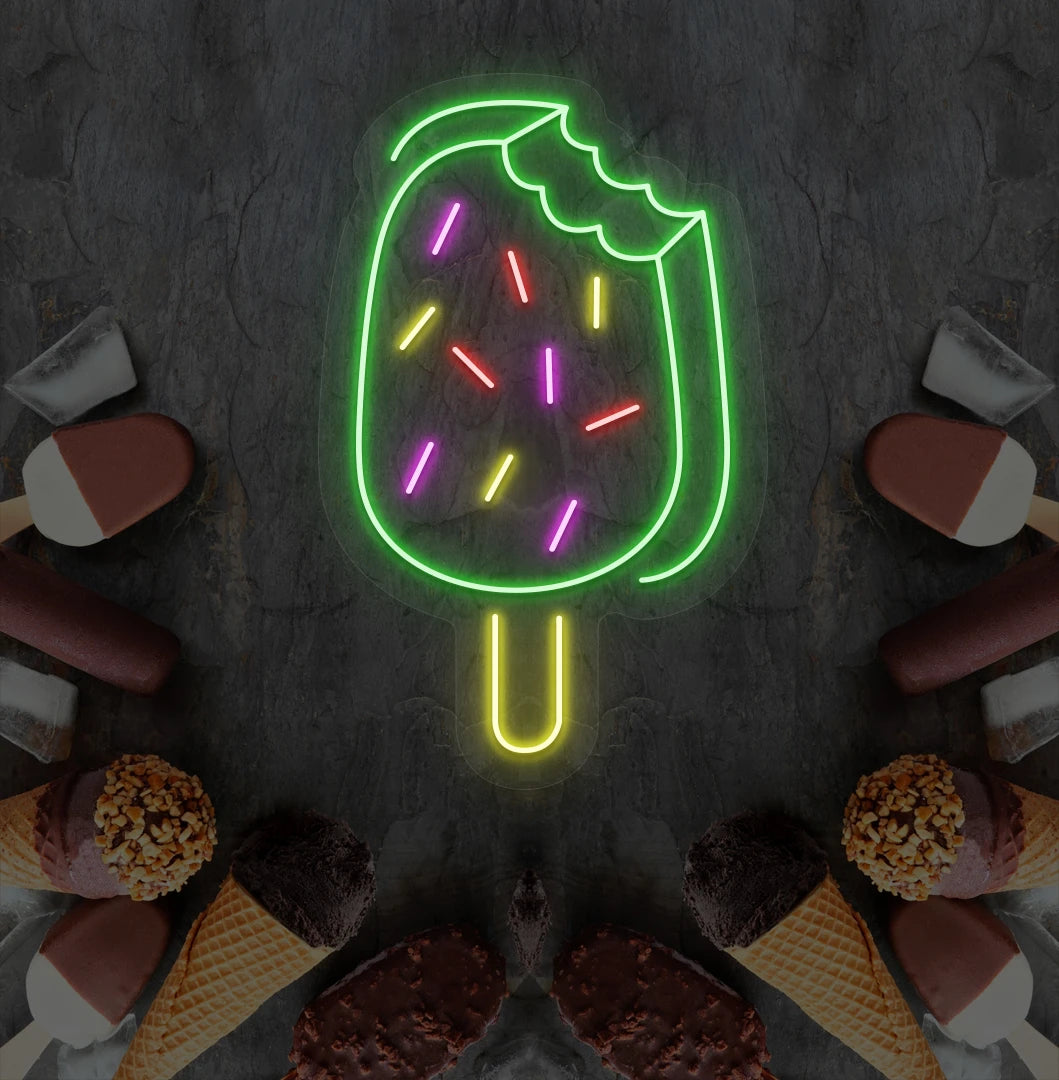 Fun ice cream bar neon sign in green mounted on dessert theme wall.