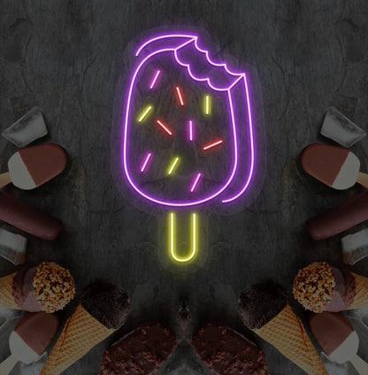 Fun ice cream bar neon sign in purple mounted on dessert theme wall.