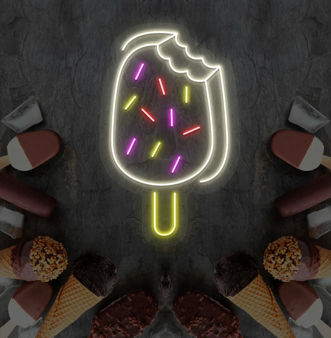 Fun ice cream bar neon sign in warm white mounted on dessert theme wall.