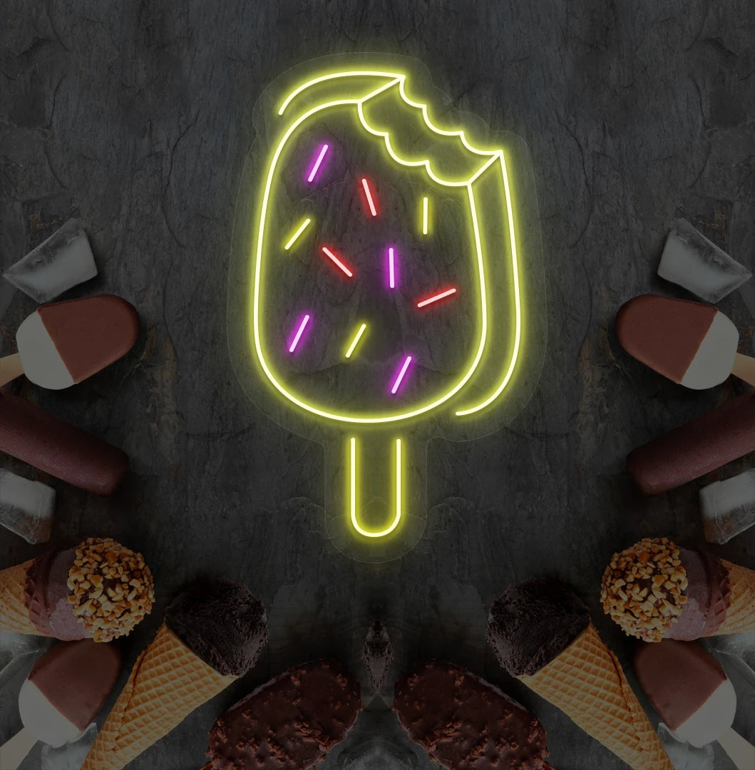 Fun ice cream bar neon sign in yellow mounted on dessert theme wall.