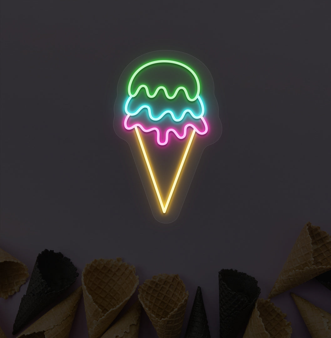 A colorful ice cream LED neon sign with pink, yellow, and green glowing on a cone wallpaper wall. For ice cream parlors, food outlets & kids' rooms.
