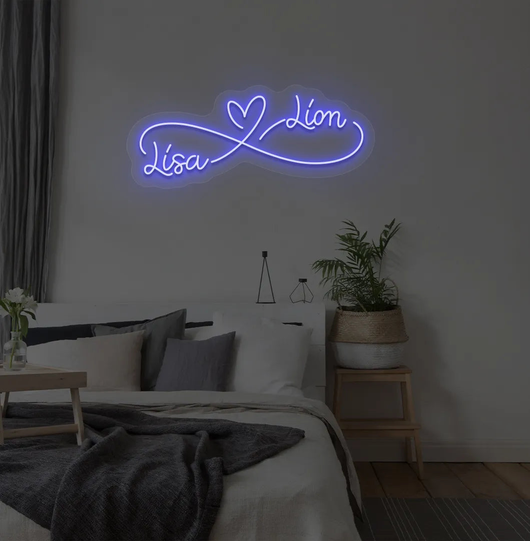 Custom Infinity Couple Name blue LED neon sign mounted on bedroom wall.