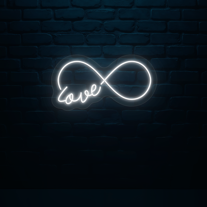 Image of a romantic "infinity love" LED neon sign glowing on wall in white color.