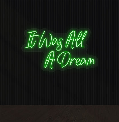Stylish green LED "It was all a dream" neon sign mounted on dark wall. Perfect for bedrooms, gaming, creative studios, and aesthetic interiors.